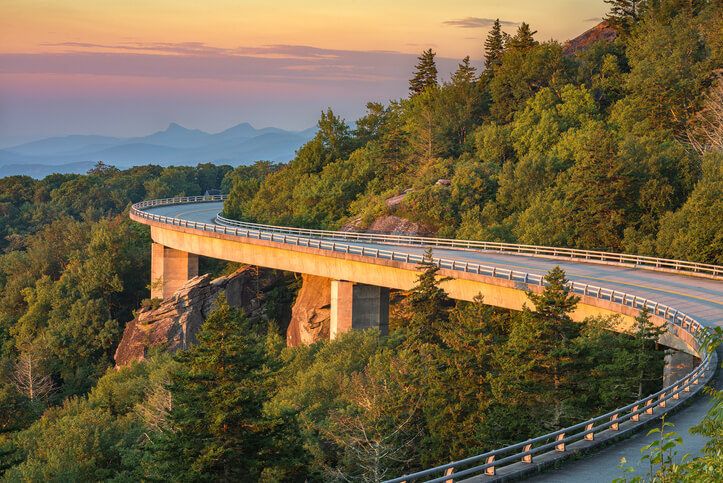 Fun Weekend Trip in Your State: morning light spills out on the Lynn Cove viaduct along the Blue Ridge Parkway in North Carolina