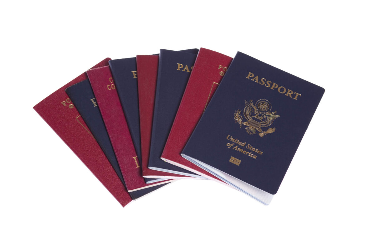United States of America passport book on top of other countries' passports