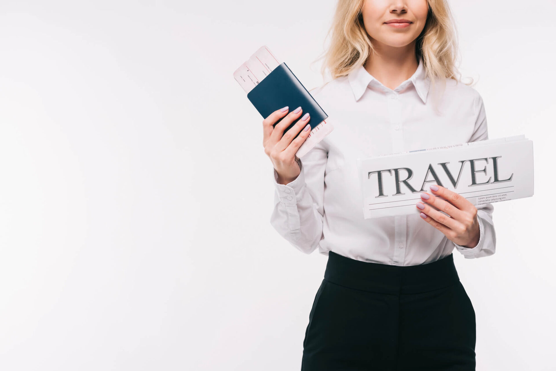 Most powerful passport image image cropped of a businesswoman holding passport, ticket and travel newspaper isolated on white
