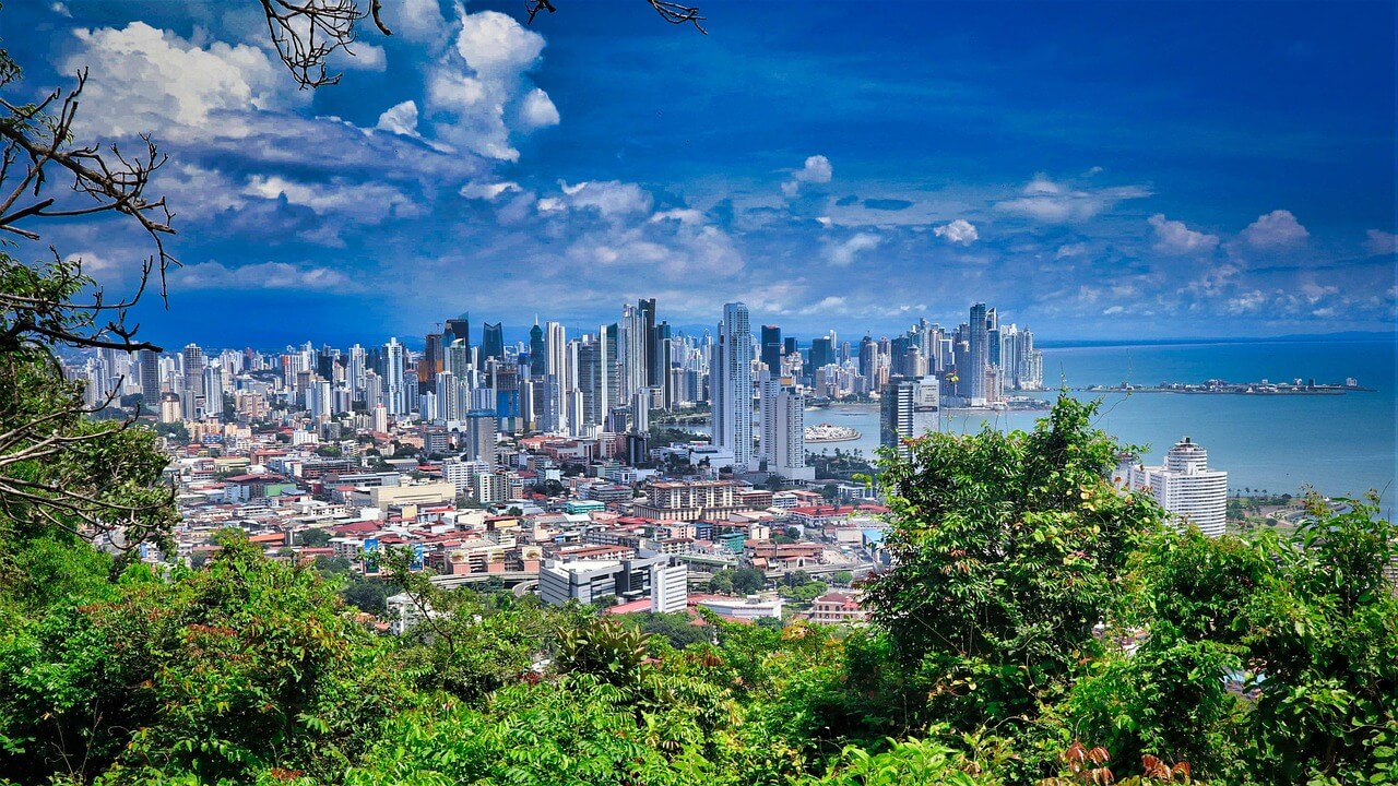 Panama city, Panama skyline showing many high rise buildings, the ocean and trees. Voted one of the best countries for expats